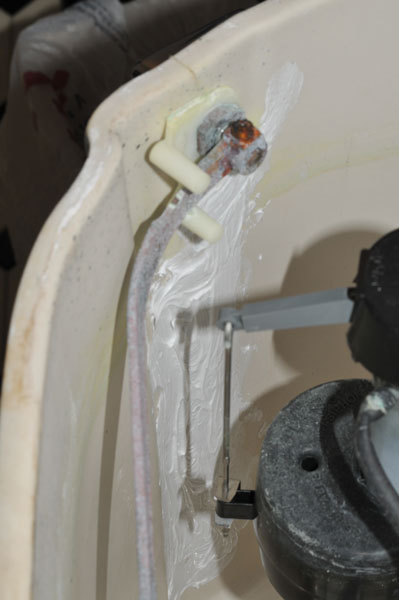 Toilet Tank
        hairline crack repair attempt