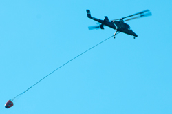 24 May 2015 A new chopper heading for
                            Lake Mendocino to get water. Maybe an Apache
                            AH64 modified for fire duty?