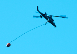 24 May 2015 A new chopper heading for
                            Lake Mendocino to get water. Maybe an Apache
                            AH64 modified for fire duty?