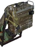 PRC-25 Strapped to
        Pack Frame on top shelf