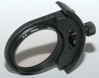 Nikon 300mm
                    f/2.8 lens Filter Holder with Nikon A2 39mm filter
                    installed